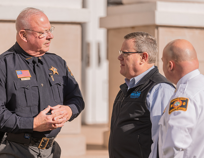 Tim Moore speaking with law enforcement